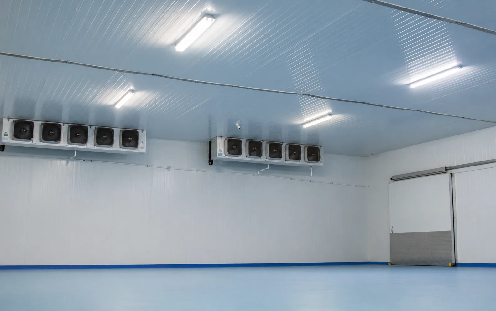 Empty cold storage room with ceiling evaporators at the Bonum plant.