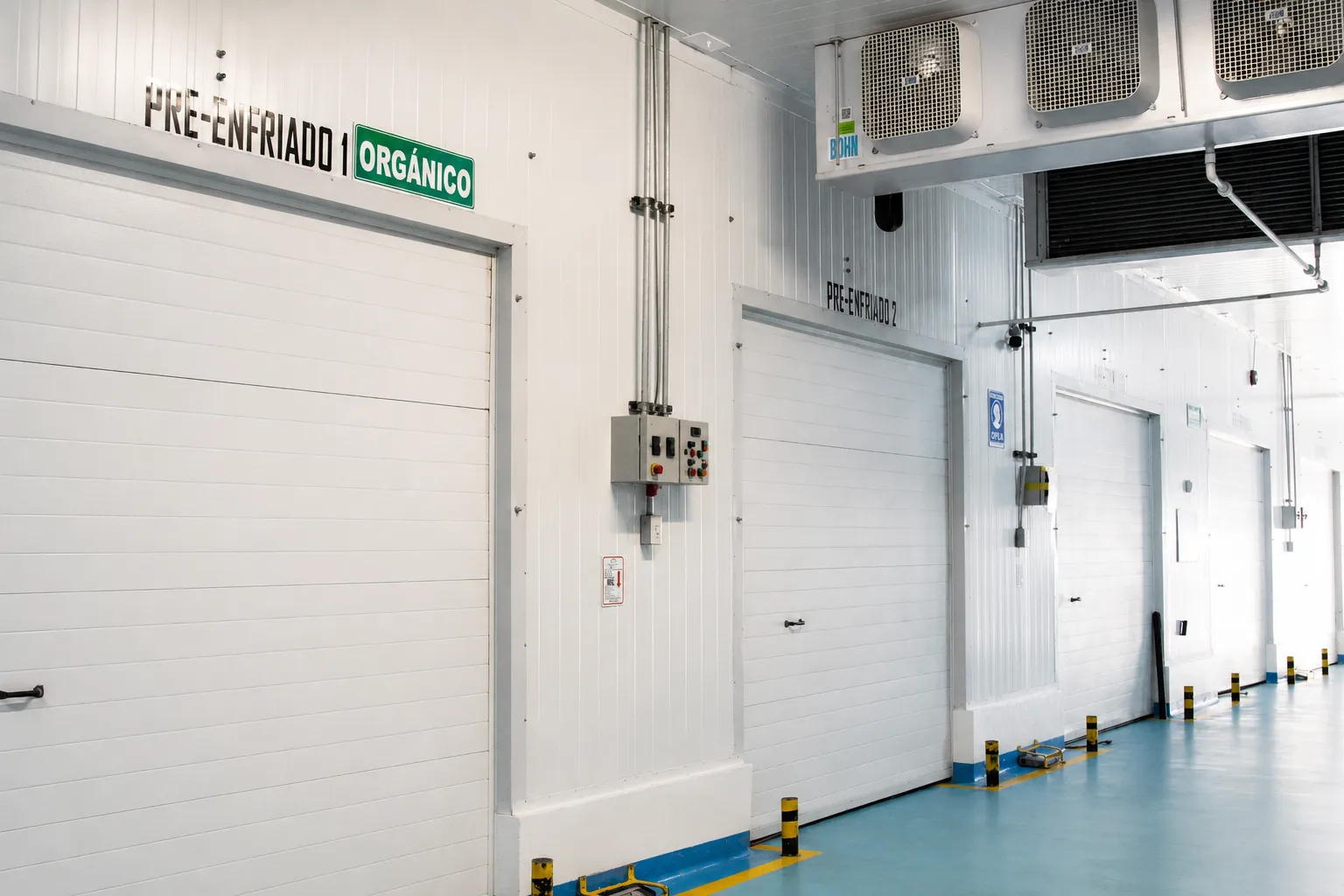 Doors of precooling tunnels 1 and 2 at the Bonum plant; tunnel 1 marked for organic handling.